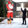 Outsunny 7FT Hanging Christmas Inflatable Santa with Dog, Christmas Blow Up Decoration with Built-in LED Lights for Garden